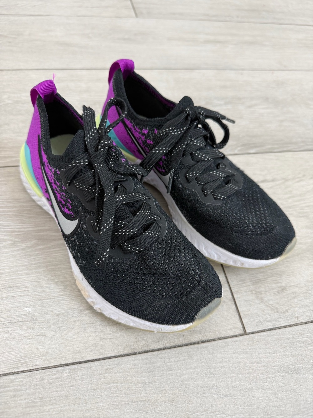 Nike Kids Black Sneakers with Purple and Iridescent Accents